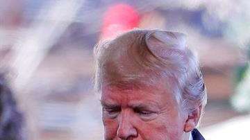 El presidente Donald J. Trump y su esposa, Melania, asisten al funeral del evangelista Billy Graham en Charlotte.