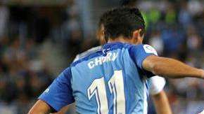 El delantero del Real Madrid, Lucas Vázquez ante los defensores del Málaga en La Rosaleda. (Foto: EFE/Daniel Pérez)
