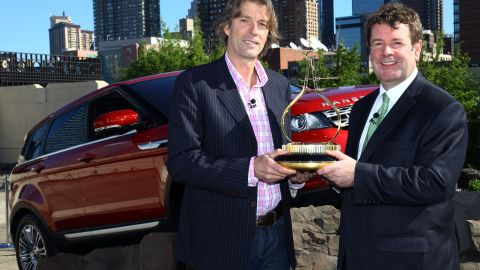 NEW YORK, NY - OCTOBER 25:  Andy Goss, President of Land Rover North America (R), accepts Motor Trend's 2012 Sport/Utility of The Year Award for the all-new 2012 Range Rover Evoque from Motor Trend 's Editor-in-Chief Angus MacKenzie on October 25, 2011 in New York City. The all-new Range Rover Evoque is the lightest and most fuel-efficient Range Rover ever produced and goes on sale this month.  (Photo by Neilson Barnard/Getty Images for Land Rover)