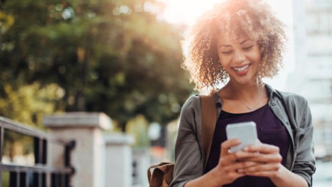 Photo of a woman using smart phone