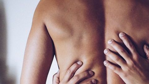 0_Rear-View-Of-Shirtless-Seductive-Woman-Sitting-On-Man-At-Home