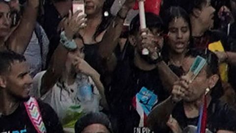 Puerto Rican singer Ricky Martin (C), alongside Puerto Rican rapper Rene Perez, aka Residente, march along Las Americas highway as they take part of a national strike demanding Puerto Rico's Governor Ricardo Rossello resignation in San Juan, Puerto Rico on, July 22, 2019. - Angry protesters blocked the main road in Puerto Rico's capital on Monday as they launched what was expected to be the largest yet of a wave of demonstrations seeking the resignation of the US territory's embattled governor. (Photo by Eric Rojas / AFP)        (Photo credit should read ERIC ROJAS/AFP/Getty Images)