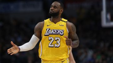 DALLAS, TEXAS - JANUARY 10:   LeBron James #23 of the Los Angeles Lakers reacts against the Dallas Mavericks at American Airlines Center on January 10, 2020 in Dallas, Texas.  NOTE TO USER: User expressly acknowledges and agrees that, by downloading and or using this photograph, User is consenting to the terms and conditions of the Getty Images License Agreement.  (Photo by Ronald Martinez/Getty Images)