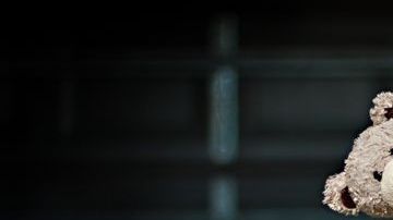 0_Low-section-of-a-girl-holding-her-teddy-bear