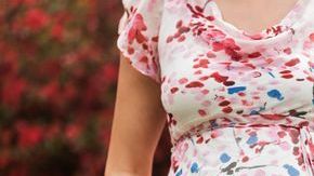 0_Pregnant-Caucasian-woman-holding-her-belly-outdoors