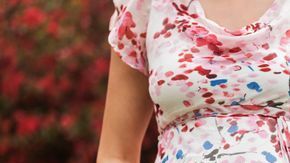 0_Pregnant-Caucasian-woman-holding-her-belly-outdoors