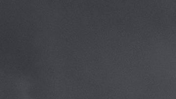 Autos de la Policía arden durante los disturbios en el oeste de L.A.