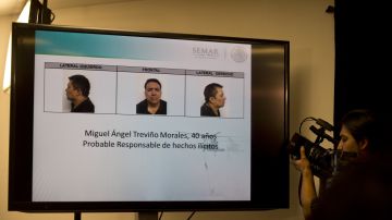 MEXICO-CRIME-DRUG-ZETAS
A cameraman takes images from a sreen of the alleged maximun leader of drugs Mexican cartel "Los Zetas", Miguel Angel Trevino Morales, presented in combo pictures during a press conference at the head quarter of Interior Ministry on July 15, 2013 in Mexico City. According to a spokesman Trevino was arrested early morning during a military operation en Nuevo Laredo.   AFP PHOTO/ Yuri CORTEZ        (Photo credit should read YURI CORTEZ/AFP via Getty Images)