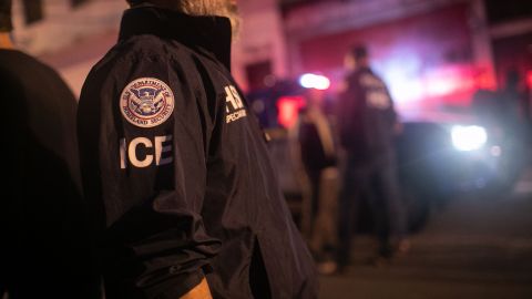 GUATEMALA CITY, GUATEMALA - MAY 29: An ICE agent with U.S. Homeland Security Investigations (HSI), watches as Guatemalan police investigate the scene after detaining a suspected human trafficker on May 29, 2019 in Guatemala City. Homeland Security agents accompanied Guatemalan police on an early morning raid, the first since Acting U.S. Homeland Security Secretary Kevin McAleenan signed an agreement with his Guatemalan counterparts, increasing cooperation on human and drug smuggling. McAleenan is on a four-day trip to Guatemala. (Photo by John Moore/Getty Images)