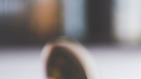 woman-with-brown-hair-doing-lipstick-and-holding-little-6393