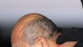 CORRIGE CRÉDITO MEX34. CIUDAD DE MÉXICO (MÉXICO), 27/02/2015.- El líder del cártel de Los Caballeros Templarios Servando Gómez Martínez alias "La Tuta" es escoltado hoy, viernes 27 de febrero de 2015, en el hangar de la Procuraduría General de la República (PGR, fiscalía) en Ciudad de México, por agentes federales hacia el helicóptero que lo llevará al penal de máxima seguridad del Altiplano, en el Estado de México. Gómez fue capturado por fuerzas especiales, en la madrugada de hoy en la ciudad de Morelia del estado de Michoacán, gracias a una larga labor de seguimiento que permitió penetrar sus círculos de seguridad, dijo hoy el comisionado nacional de Seguridad, Monte Alejandro Rubido. EFE/Mario Guzmán