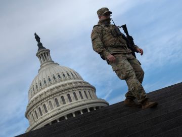 TOPSHOT - A member of the National Guard provides security at the US Capitol on January 14, 2021, in Washington, DC, a week after supporters of US President Donald Trump attacked the Capitol, and ahead of the inauguration of President-elect Joe Biden on January 20. (Photo by Brendan Smialowski / AFP) (Photo by BRENDAN SMIALOWSKI/AFP via Getty Images)