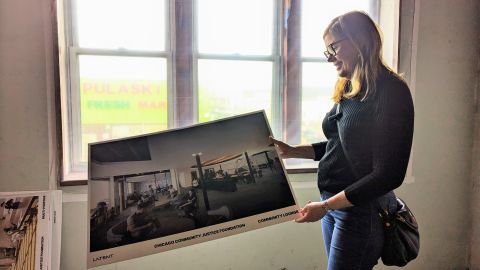 Sandi Byrd, Executive Director of CCJF, shows one of the illustrations of the future community facilities of her organization. (Irene Tostado / La Raza)