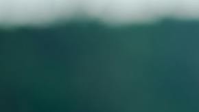 happy little girl eating tasty croissant