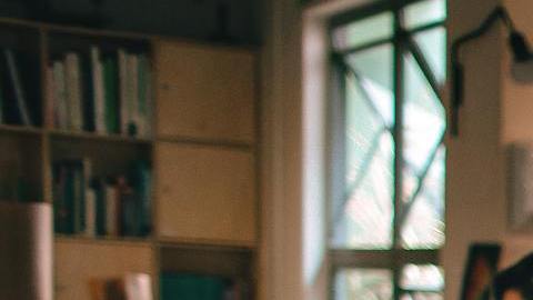 photograph of men having conversation seating on chair