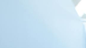 man in white medical scrub suit standing beside girl in blue denim jacket