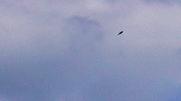 Un bañista se lanza a las aguas del Lago Michigan en el área de Chicago.